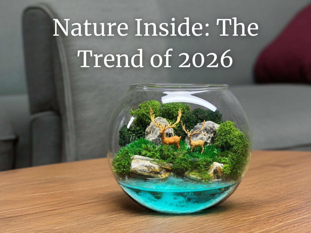 A glass terrarium with preserved moss, stones, and tiny deer figurines on a wooden surface, symbolizing the 2025 home decor trend — “Nature Inside.”