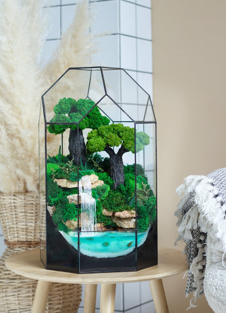 Bonsai tree n the pyramid with waterfalls and preserved moss