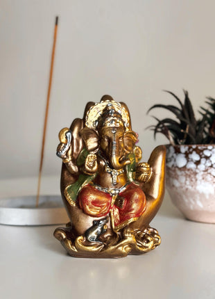Lord Ganesha Statue in Protective Palm