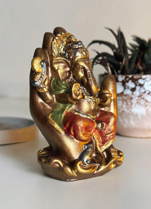 Handcrafted Ganesha Statue in Protective Palm