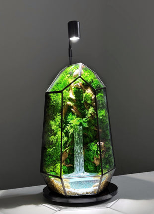 Modern glass terrarium with preserved moss, glowing pond & lamp. Handmade, maintenance-free decor — perfect for home or office!
