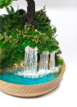 Bonsai tree with waterfall, stabilized plants and preserved  moss