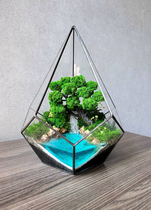 Preserved moss terrarium In the drop with waterfall