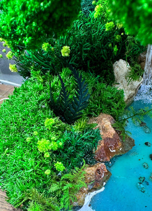 Crystal terrarium In the drop with waterfall and preserved moss 