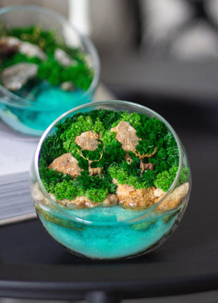 Terrarium with deers and preserved moss