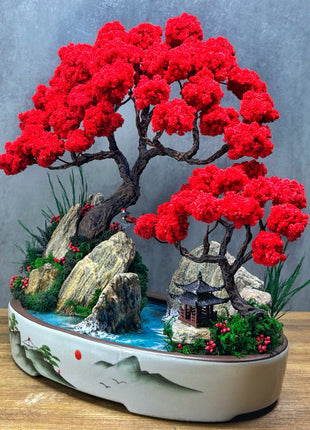 Japanese style crimson bonsai landscape centerpiece on wooden tabletop