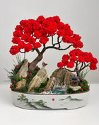 Red bonsai landscape with red trees, rocks and blue river in ceramic tray