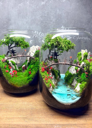 Terrarium with glowing epoxy water river moss cliffs and wooden bridge