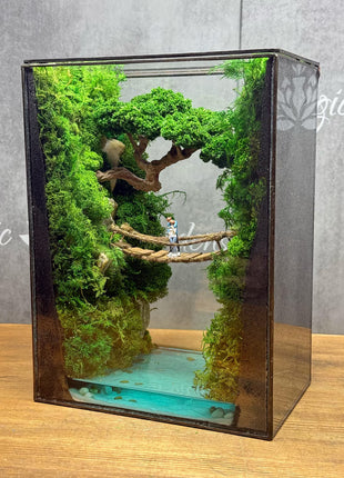Terrarium "Forest Canyon" with preserved moss and a loving couple on a bridge with a lamp.