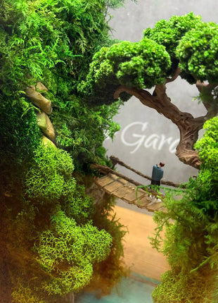 Terrarium "Forest Canyon" with preserved moss and a loving couple on a bridge with a lamp.