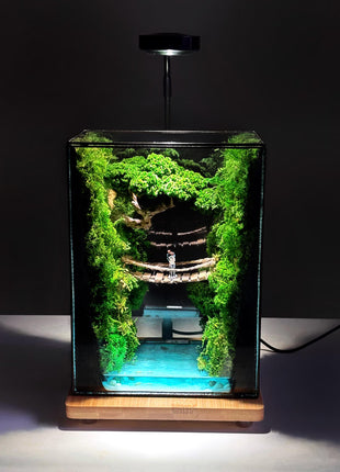 Terrarium "Forest Canyon" with preserved moss and a loving couple on a bridge with a lamp.