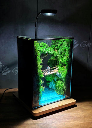 Terrarium "Forest Canyon" with preserved moss and a loving couple on a bridge with a lamp.