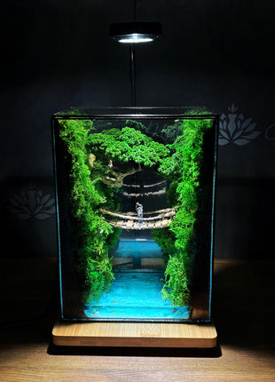Terrarium "Forest Canyon" with preserved moss and a loving couple on a bridge with a lamp.