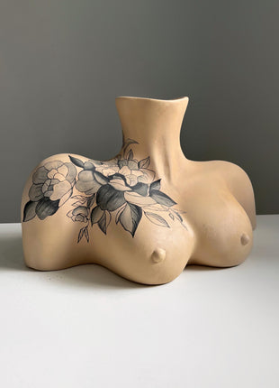 Big natural woman breasts with tattoo