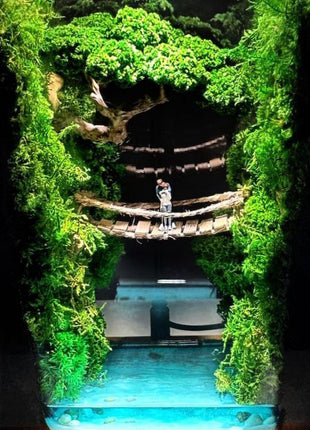 Terrarium "Forest Canyon" with preserved moss and a loving couple on a bridge with a lamp.