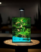 preserved moss terrarium with LED light and epoxy water effect on wooden base