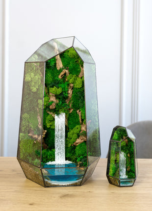 Glass terrarium with forest waterfall and preserved moss Minimalism