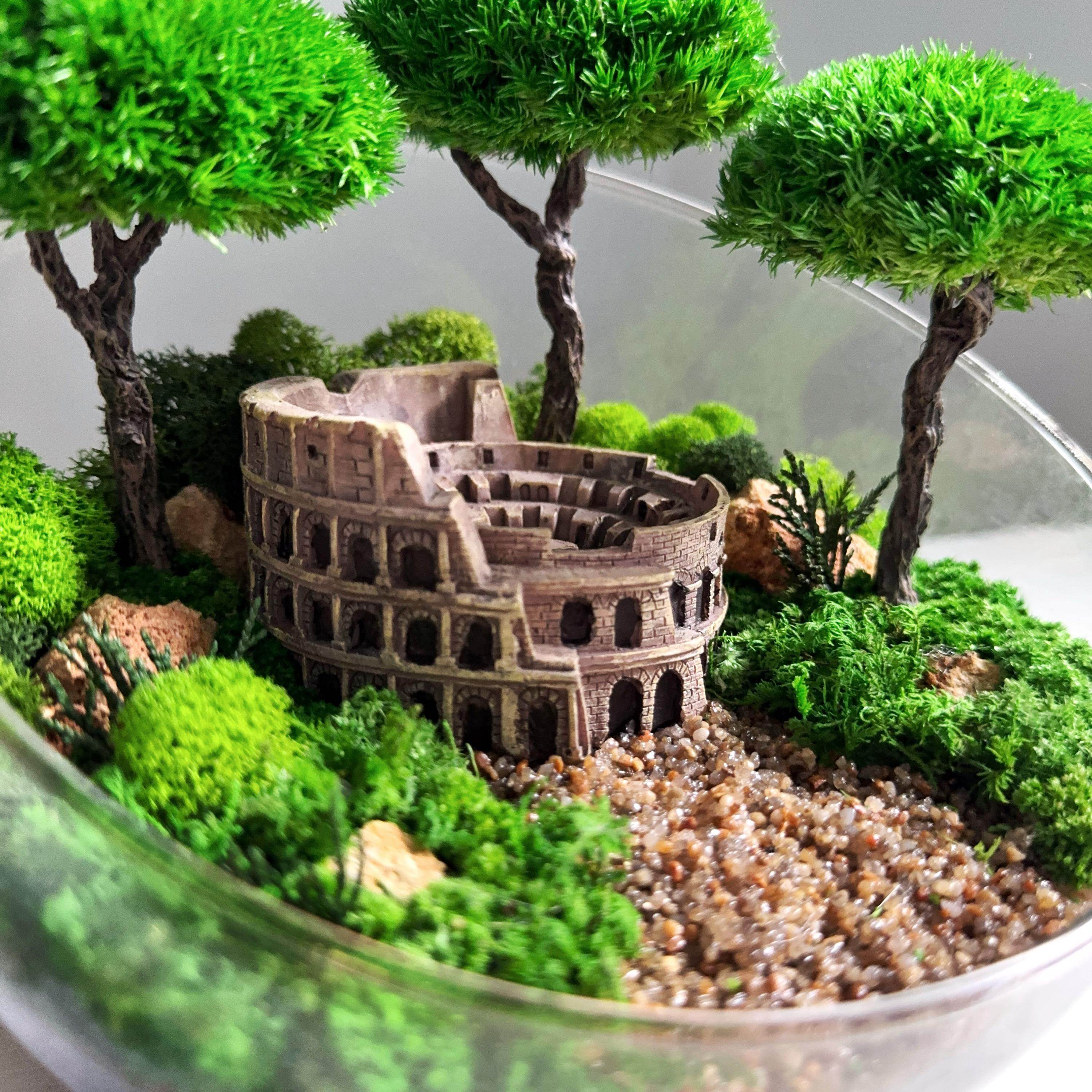 bonsai tree in glass bowl Terrarium in a glass bowl with preserved bonsai trees and Colosseum Mini Landscape